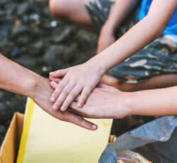 Close up volunteer teamwork join hands in environment conservation ,Volunteering world environment day.